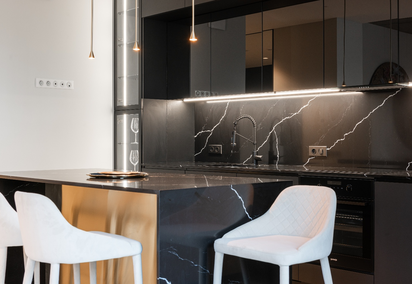 A black kitchen countertop and interior made using marble