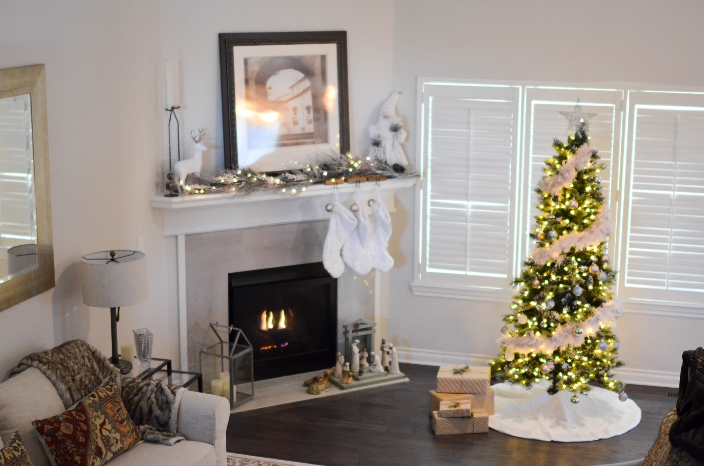 A sophisticated and elegant interior boasts a classy marble fireplace