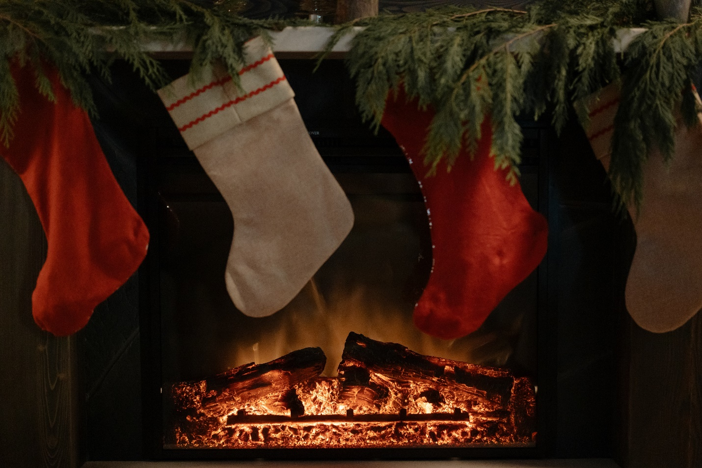 a fireplace decorated with stockings