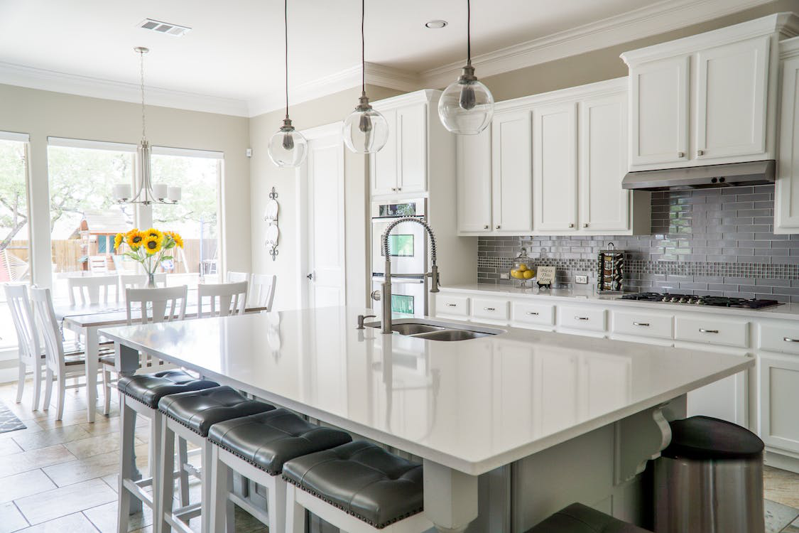 Kitchen with white interior and marble countertops