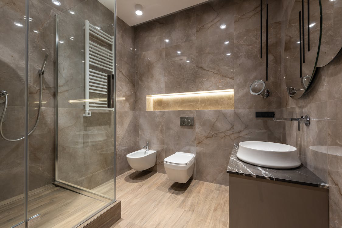 Bathroom interior with shower cabin and tiled walls