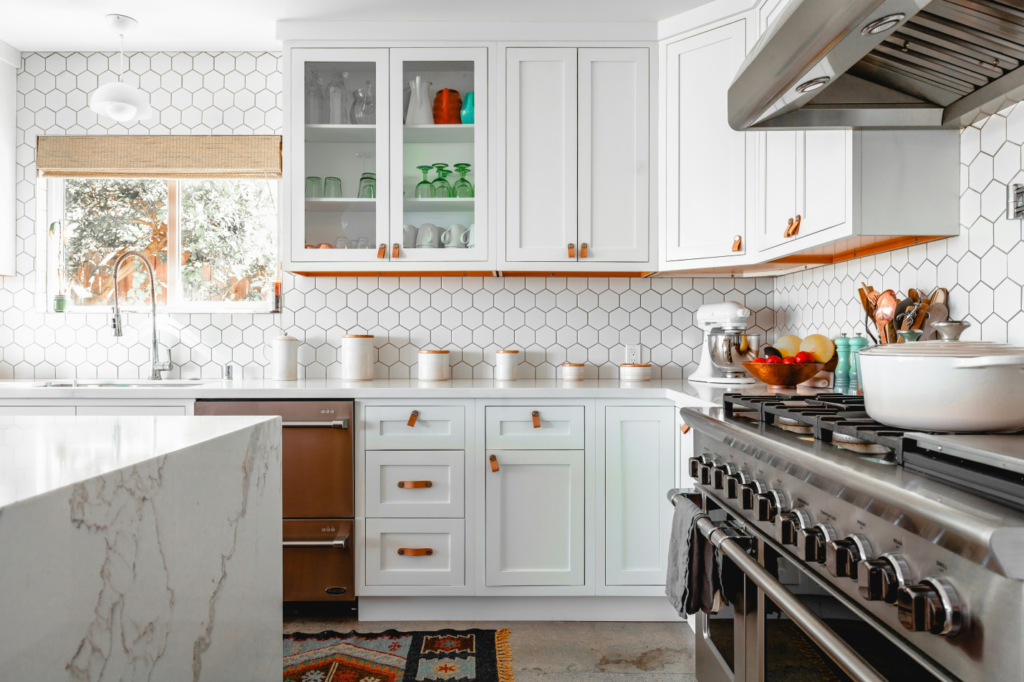 white colored cabinets in a kitchen

Caption: a classic kitchen design with marble tops