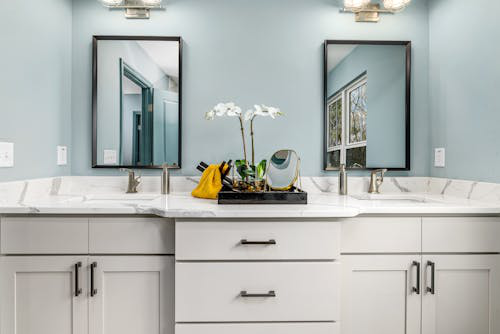 Contemporary bathroom in Naples vanity with a custom granite countertop.