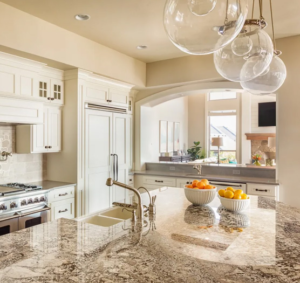 Two-tone countertop featuring light quartz and dark granite in a modern kitchen setting.