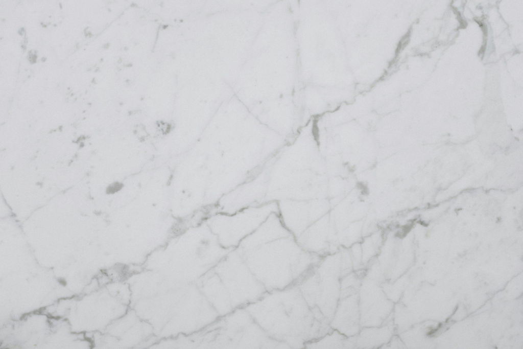 Close-up of a white quartz countertop with subtle veining