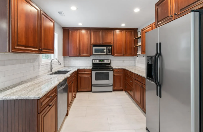 A kitchen countertop with a light-colored granite surface
