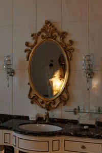 A sink in the bathroom with a mirror